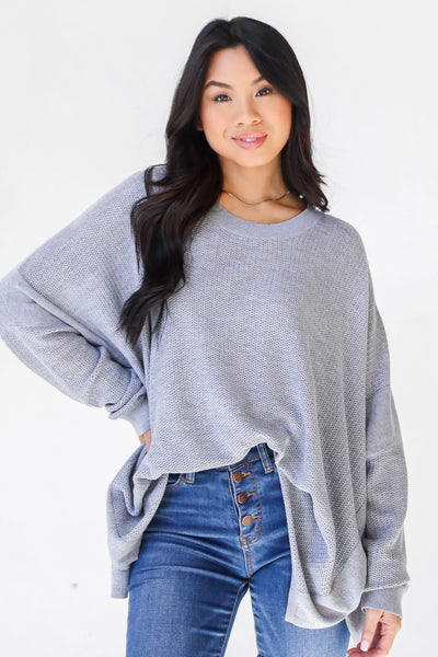model wearing an oversized Sweater with denim