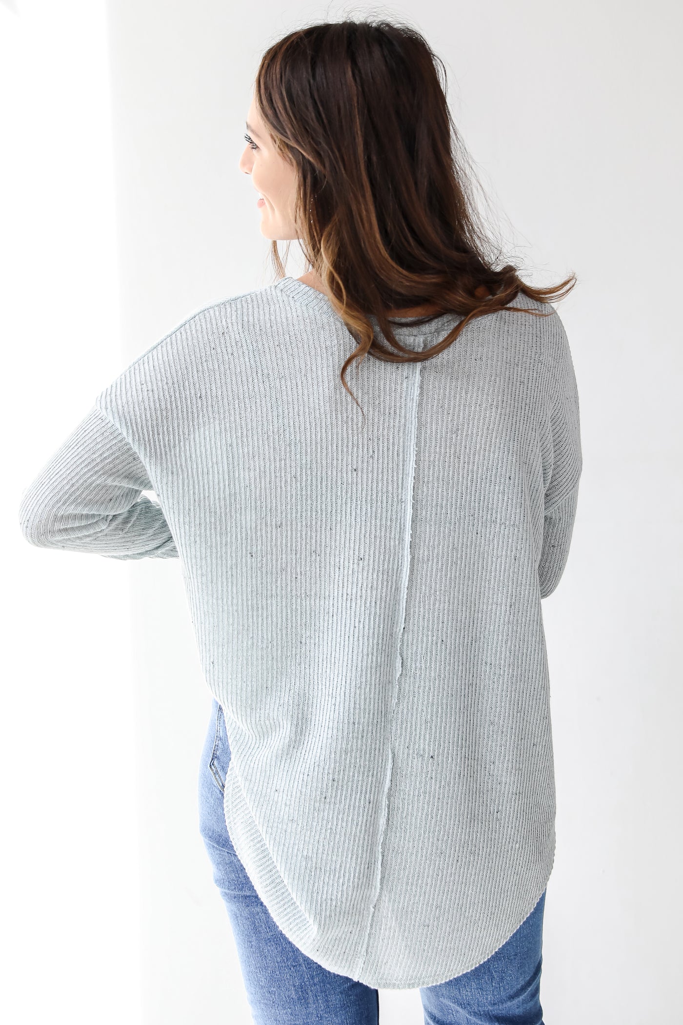 blue knit top back view