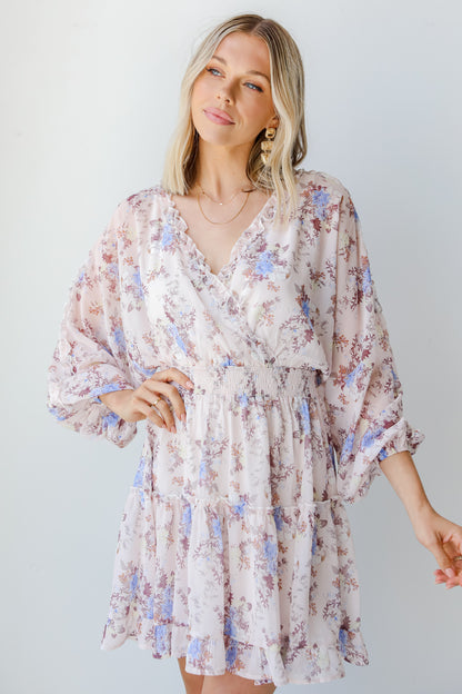 model wearing a blush Floral Mini Dress