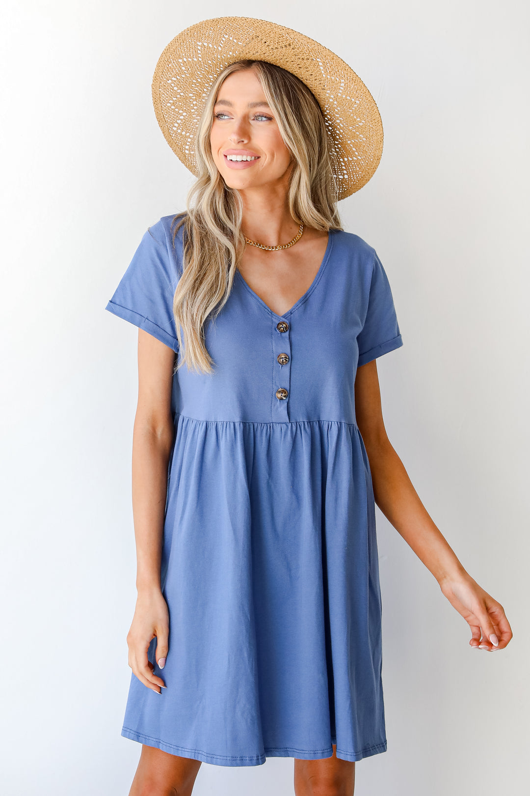 Button Front Babydoll Dress in blue on model