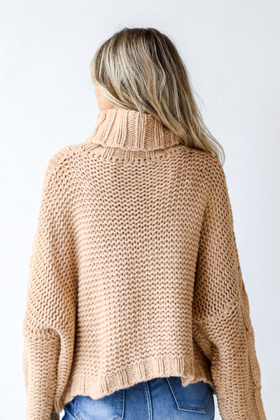 Cable Knit Turtleneck Sweater in taupe back view