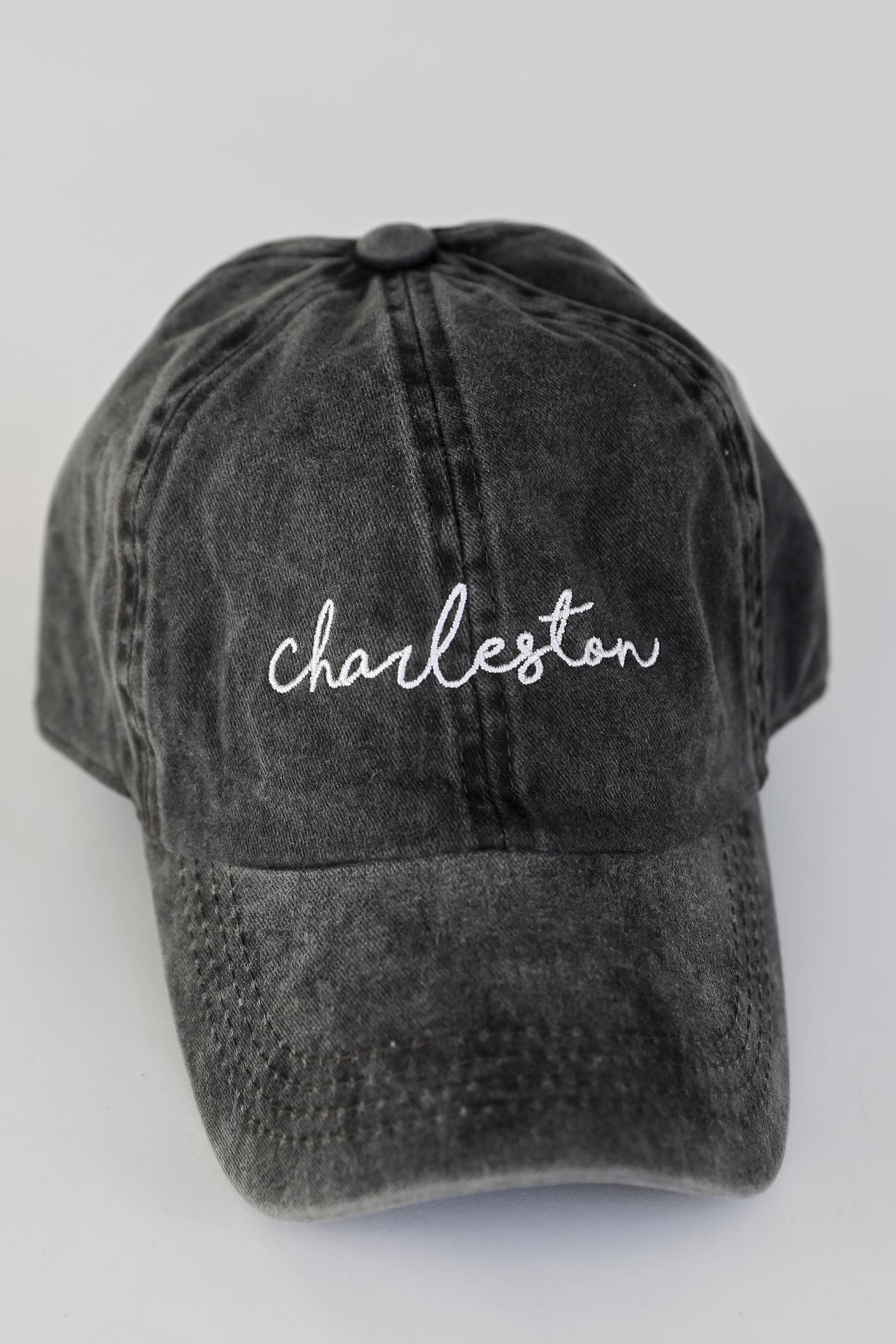 Charleston Script Embroidered Hat in black flat lay