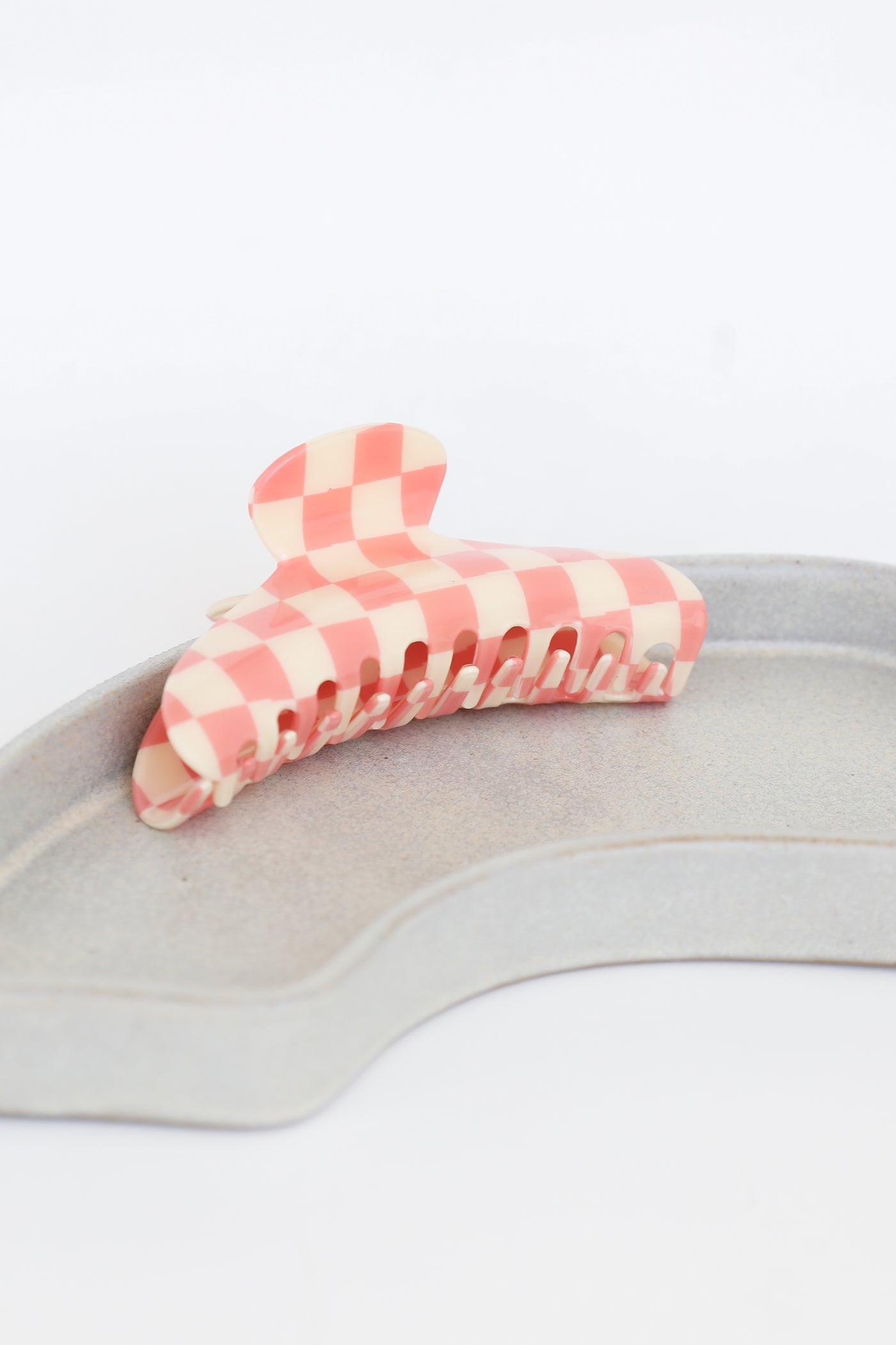 pink Checkered Claw Hair Clip flat lay