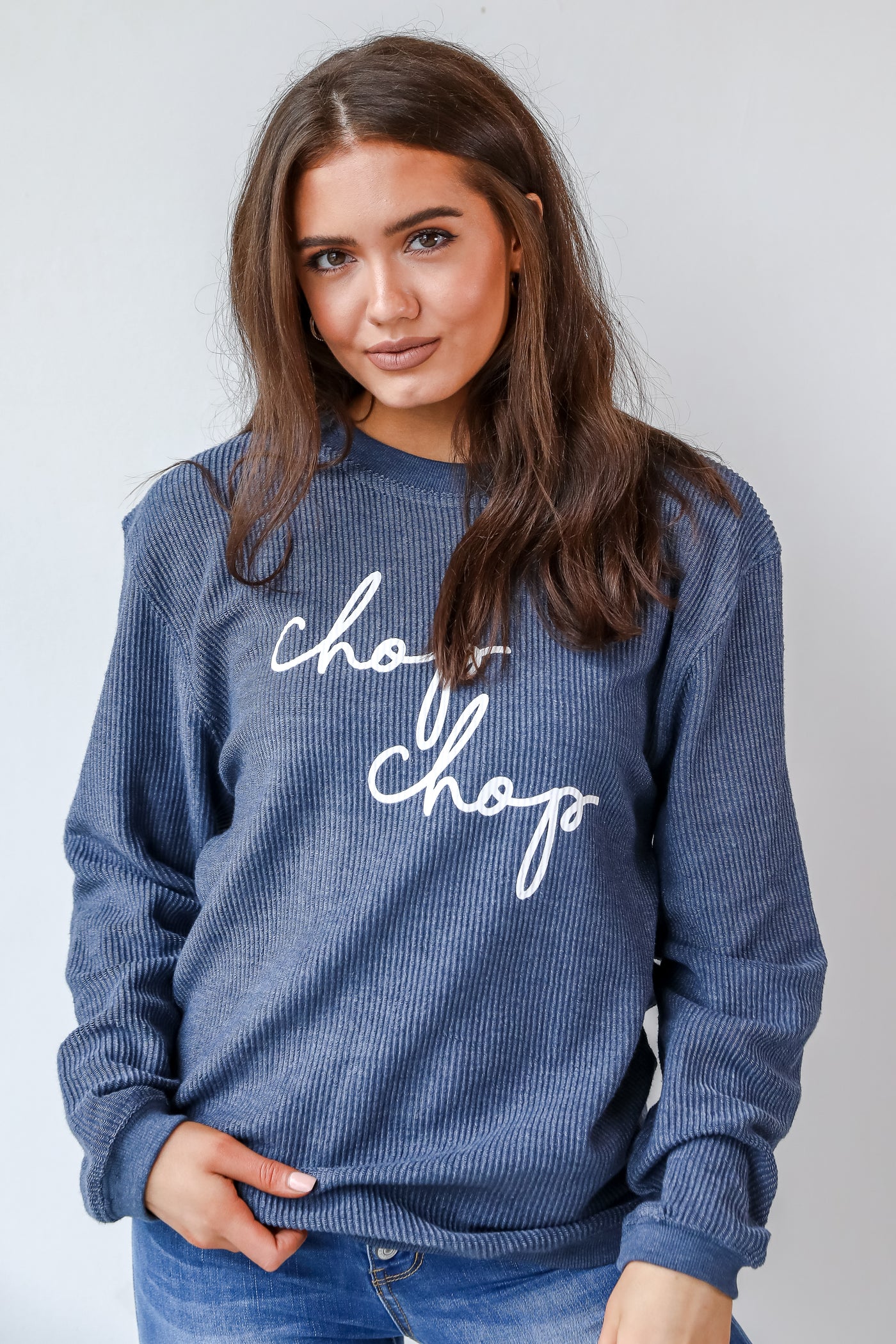 This comfy sweatshirt is designed with a soft and stretchy corded knit. It features a crew neckline, long sleeves, an oversized fit, and the words "Chop Chop" on the front.