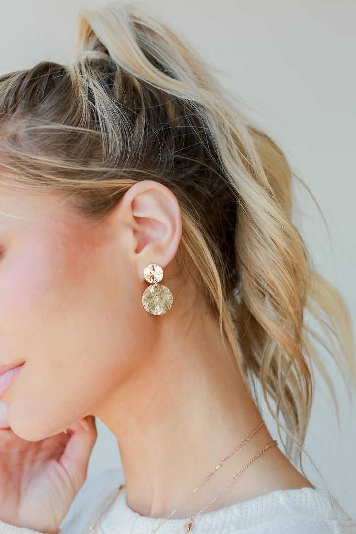 Gold Hammered Drop Earrings on model