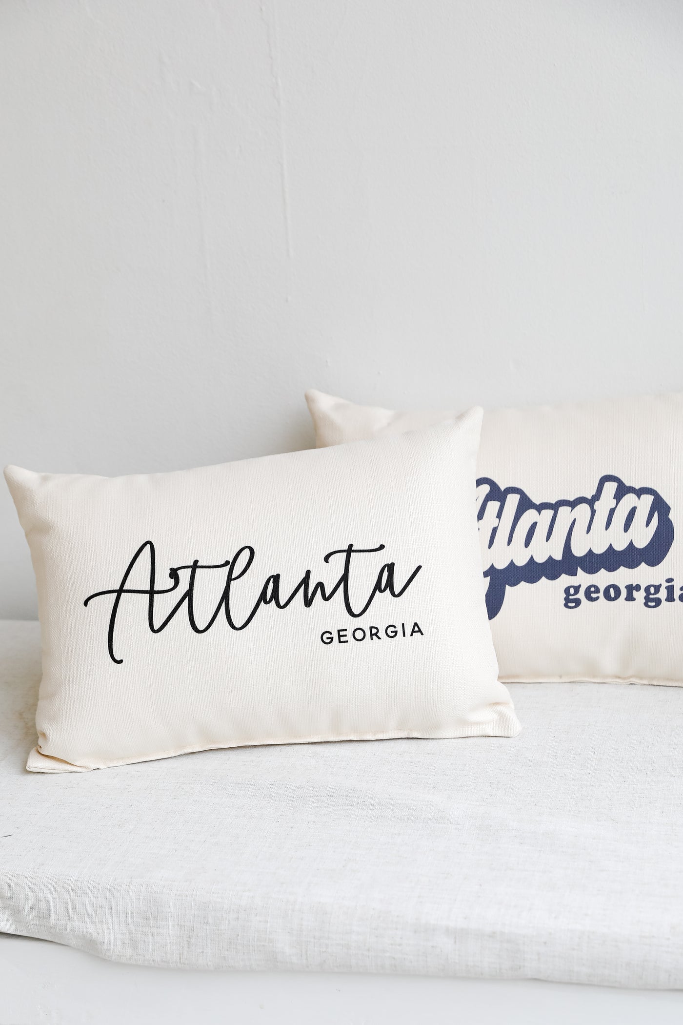 Atlanta Script Pillow flat lay