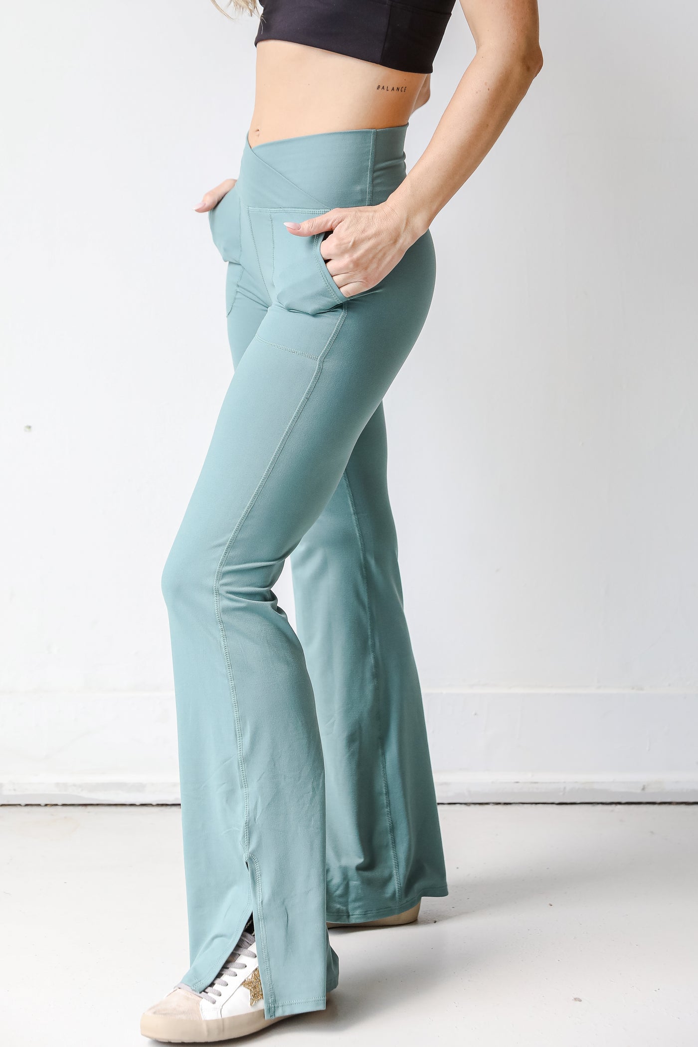 Crossover Flared Leggings in teal side view