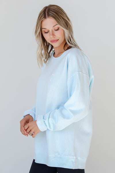 Light Blue God Is Good Cross Pullover side view
