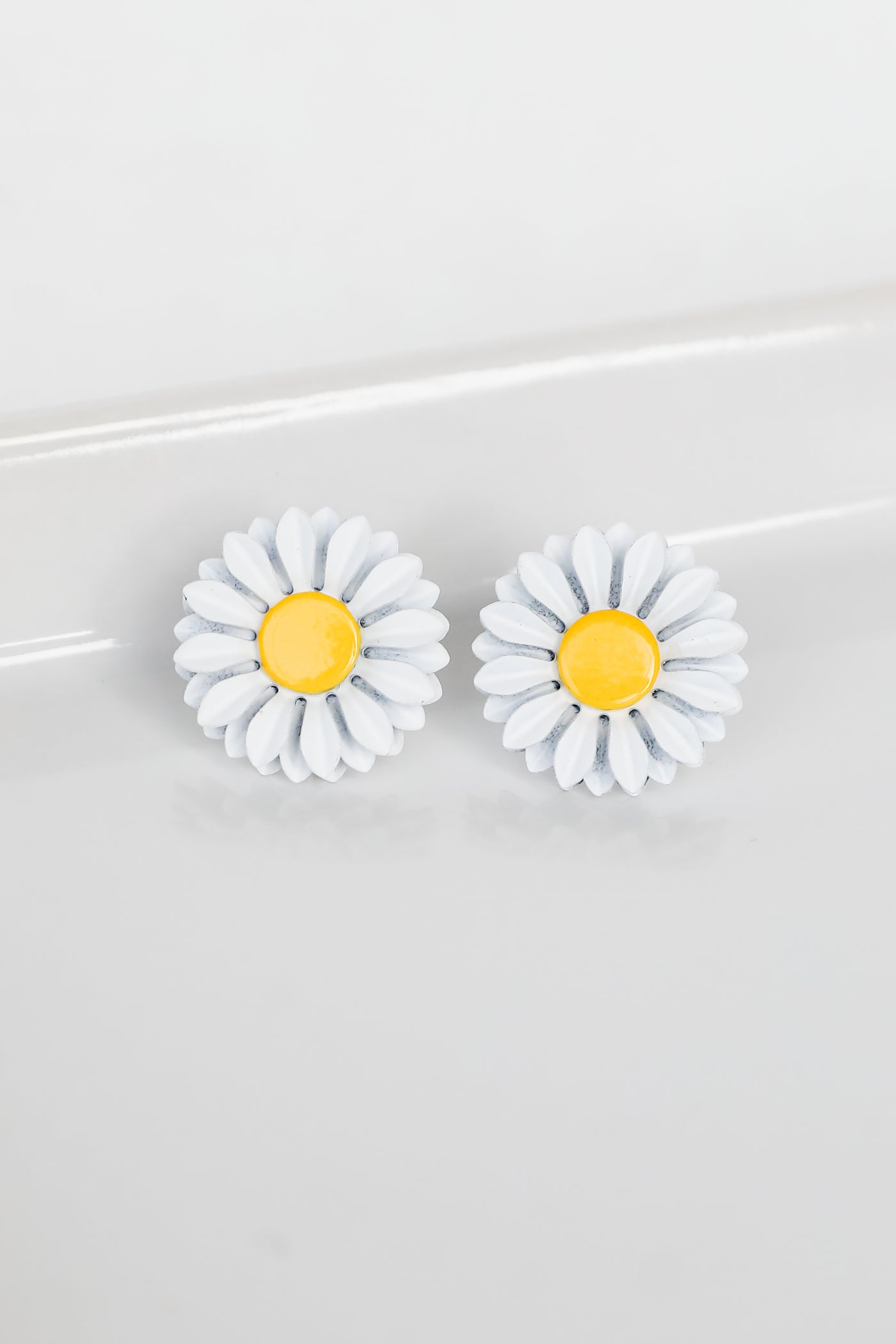Flower Stud Earrings in white flat lay