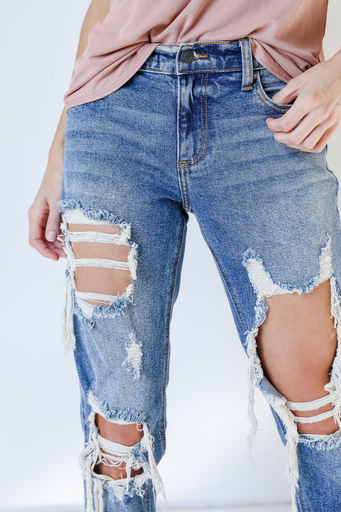 distressed denim jeans with booties