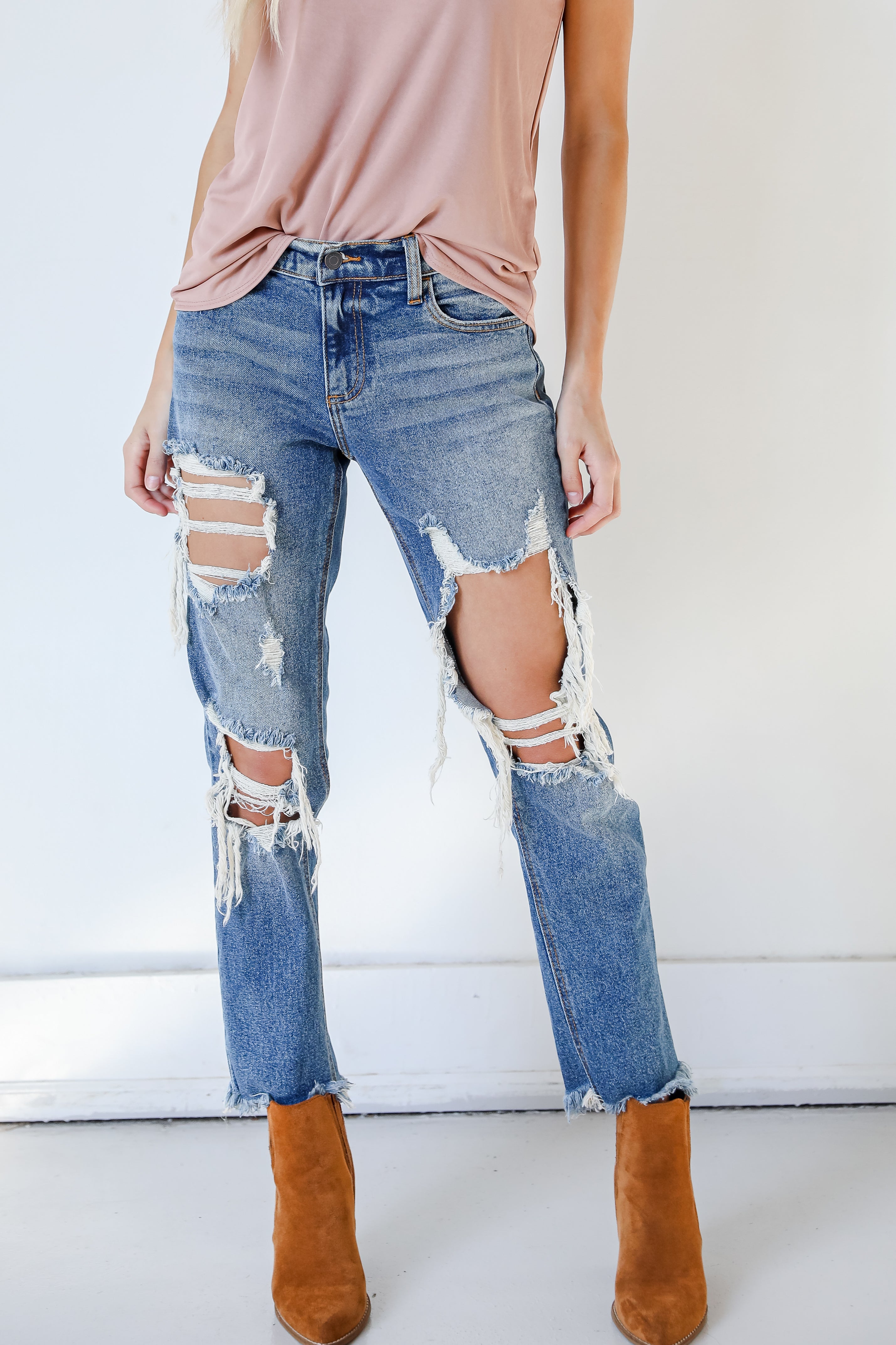distressed denim jeans with booties