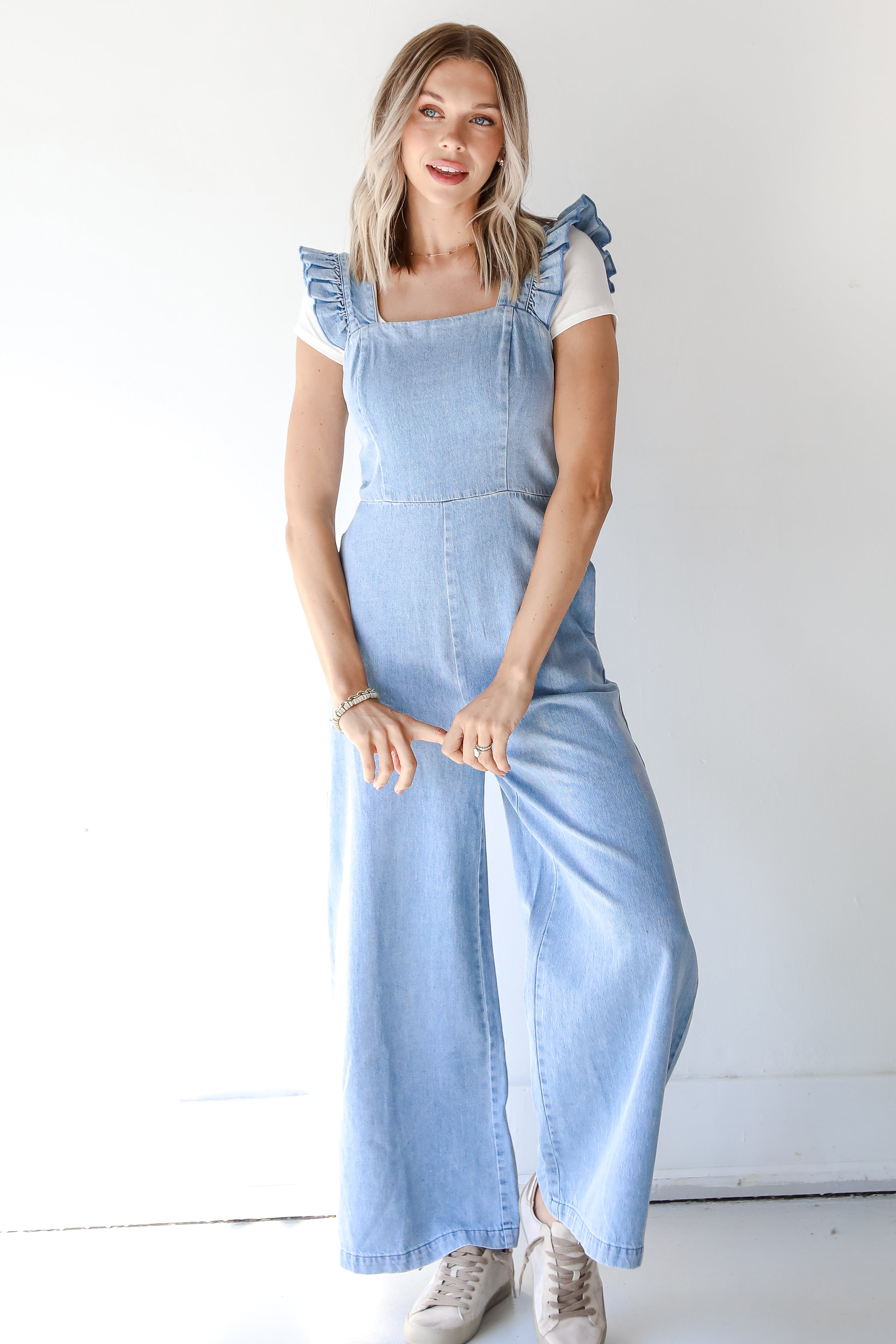 front view of a denim jumpsuit