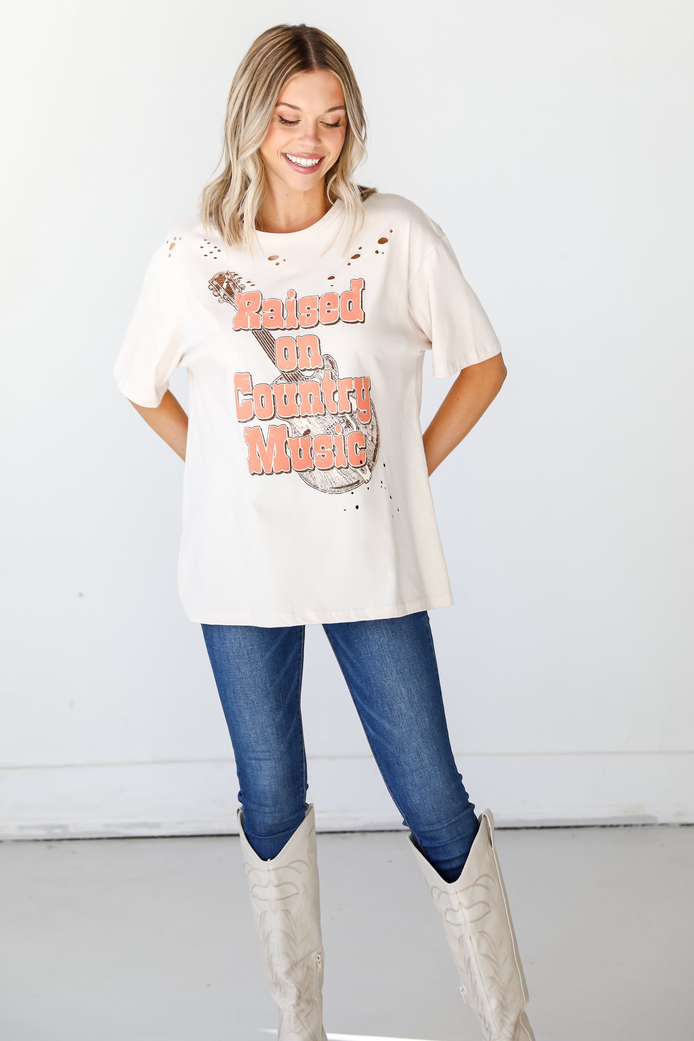Raised On Country Music Distressed Graphic Tee front view
