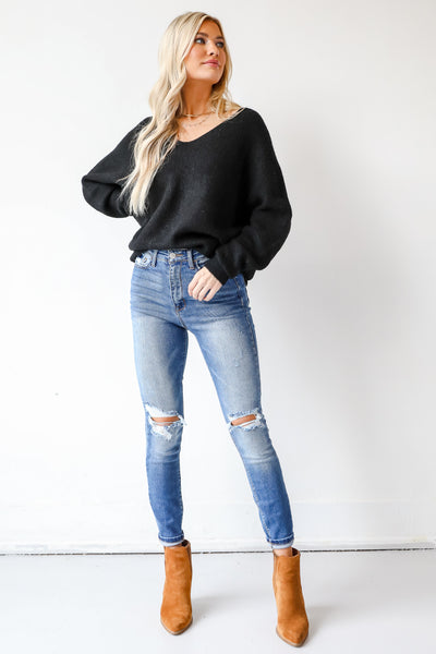 model wearing Distressed Skinny Jeans