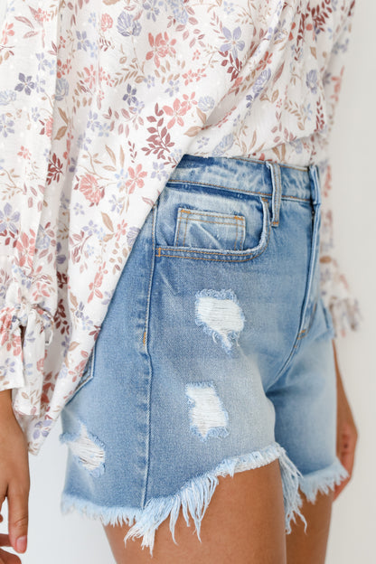 model wearing Distressed Denim Shorts