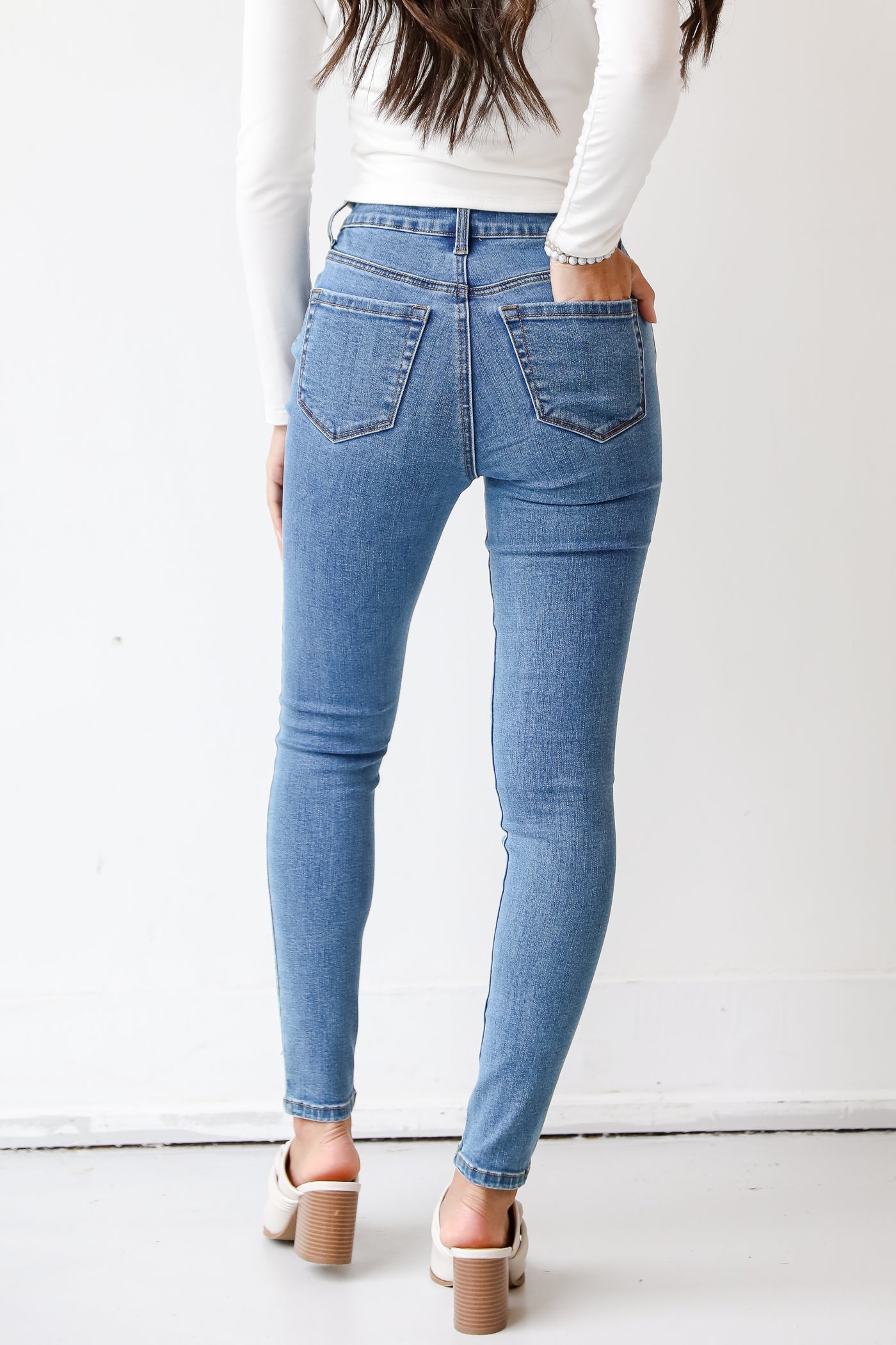 medium wash skinny jeans back view