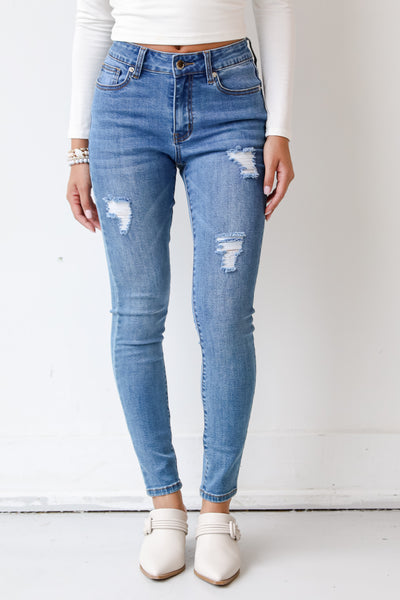 medium wash skinny jeans front view on model