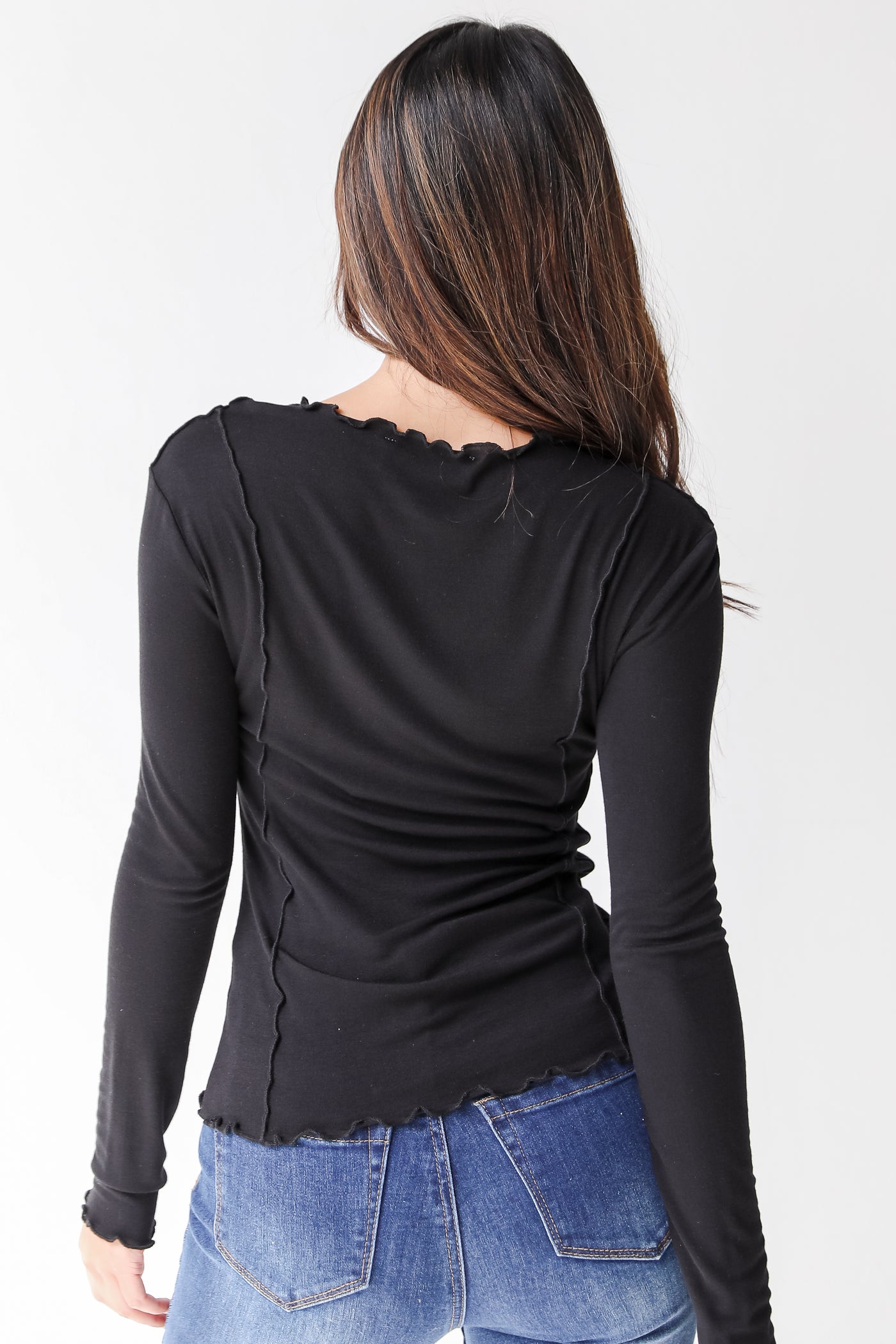 black exposed seam top back view