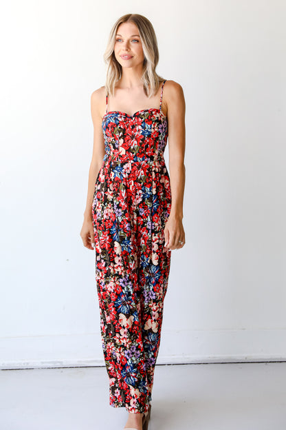 model wearing a floral jumpsuit