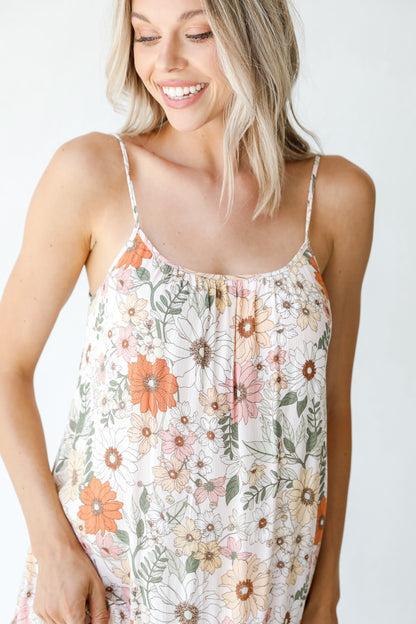 model wearing an ivory Floral Maxi Dress