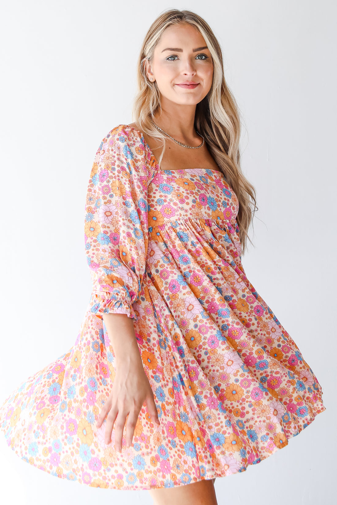 pink floral mini dress on model