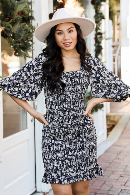 Smocked Floral Mini Dress on model
