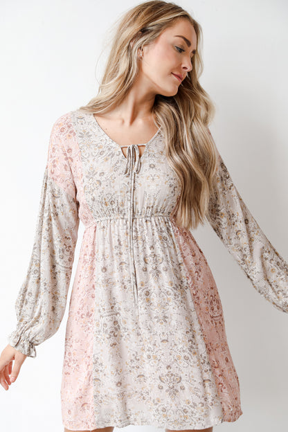 model wearing a floral mini dress