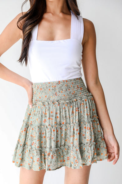 Floral Tiered Mini Skirt in sage on model