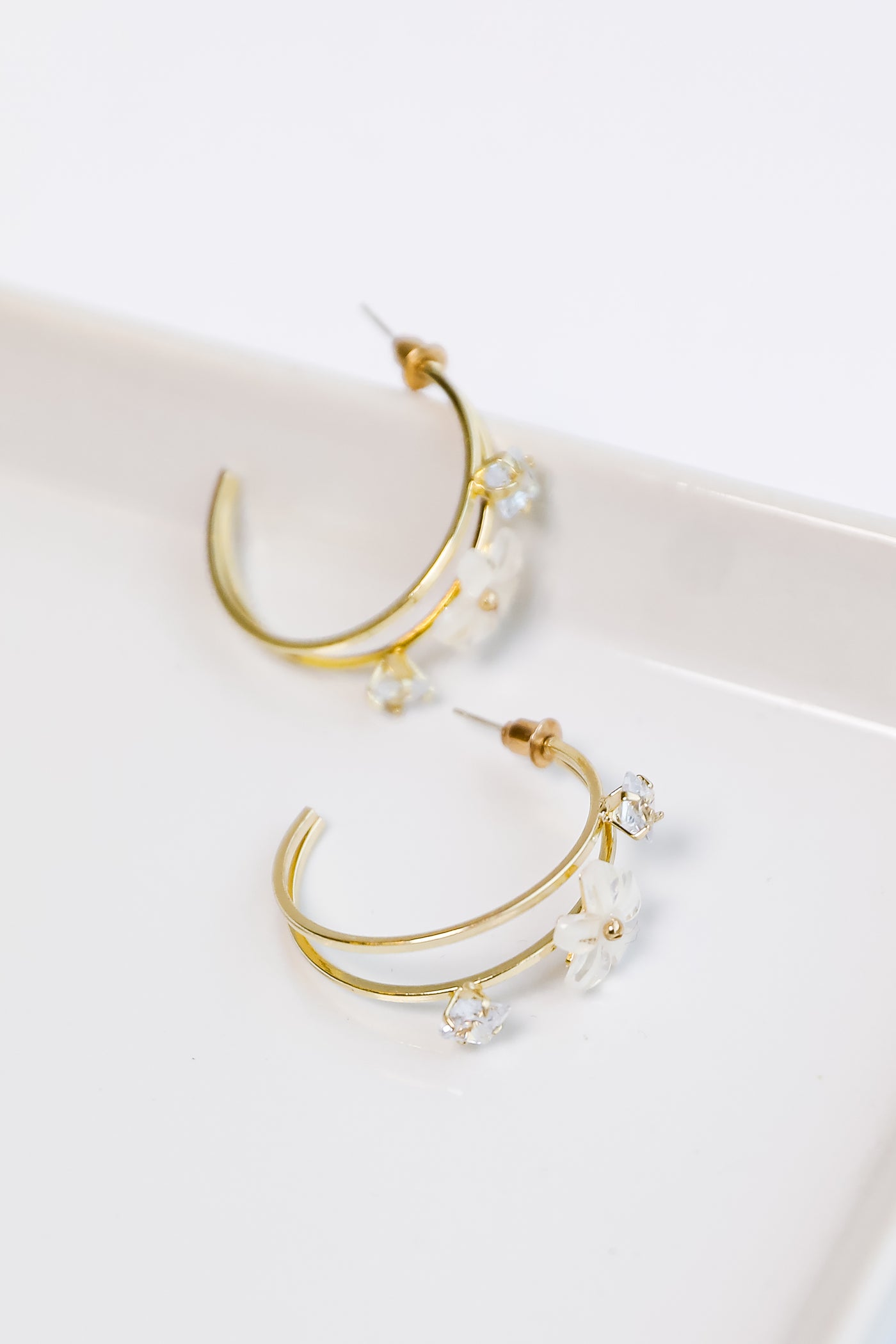 Gold Flower + Rhinestone Hoop Earrings flat lay