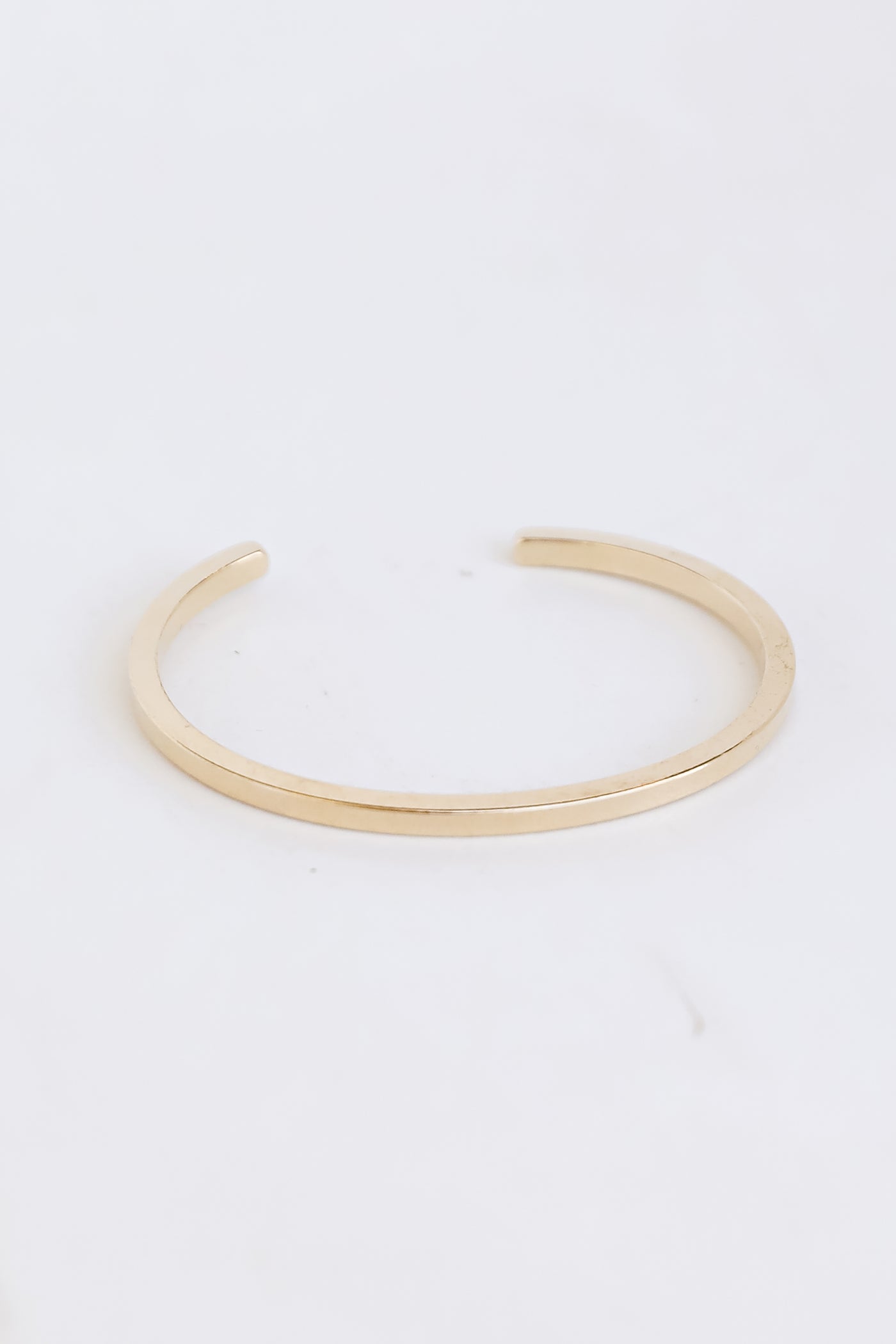 Gold Cuff Bracelet flat lay