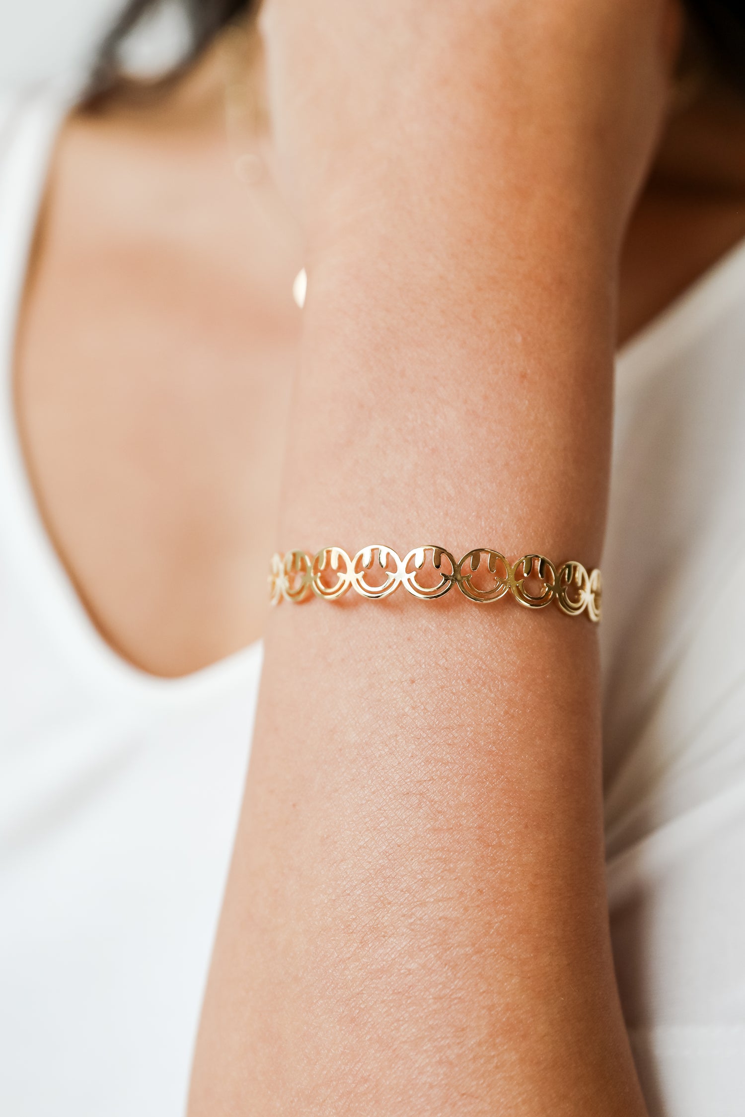 Gold Smiley Face Cuff Bracelet on model