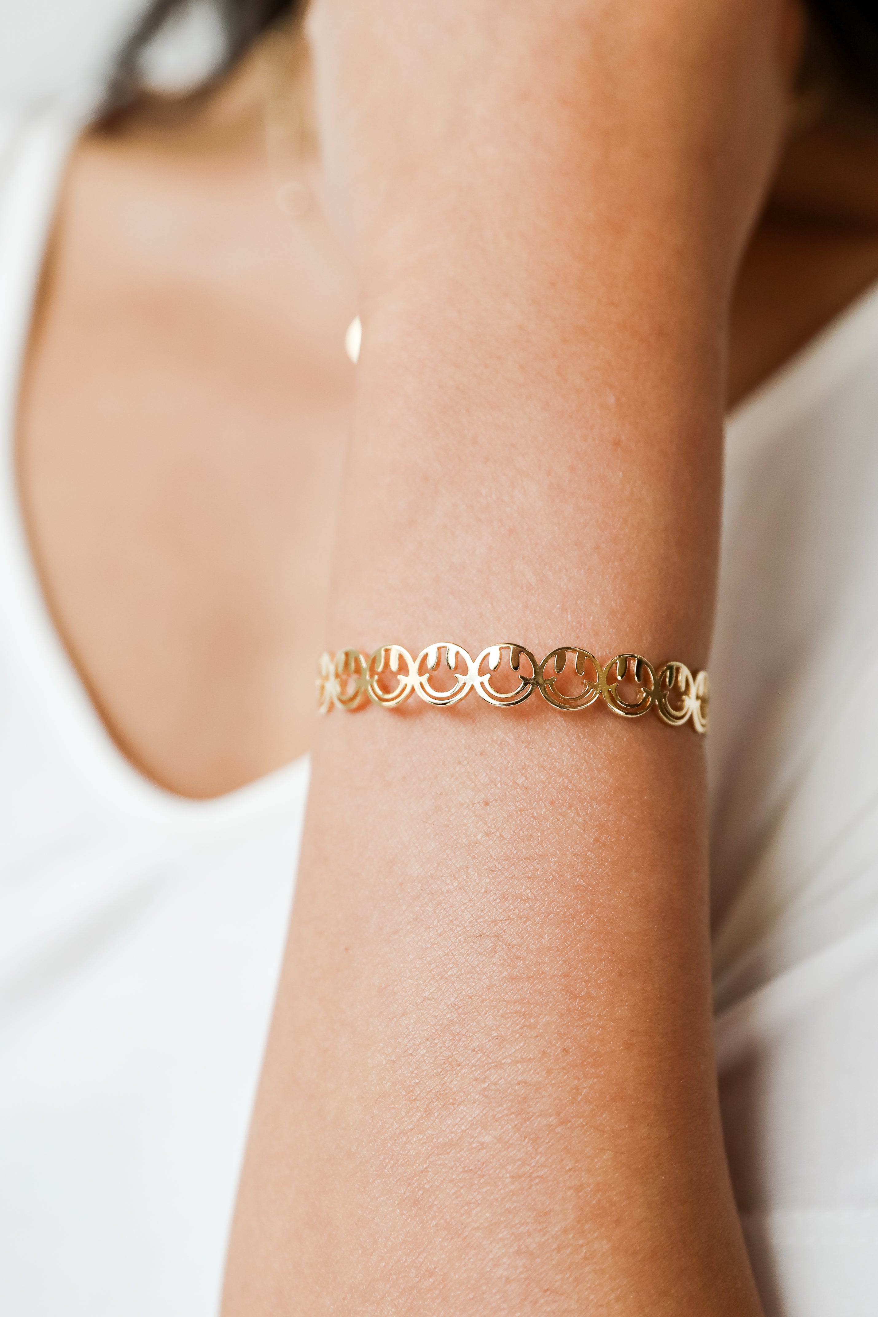 Gold Smiley Face Cuff Bracelet on model