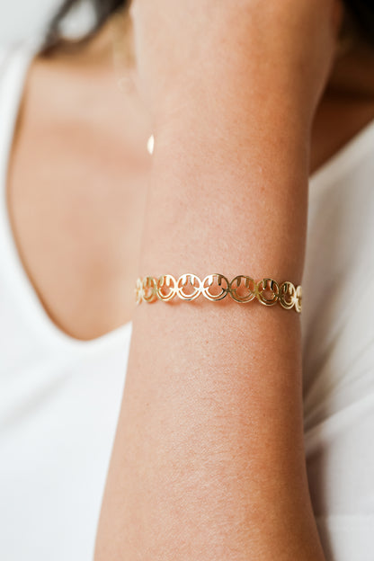 Gold Smiley Face Cuff Bracelet on model