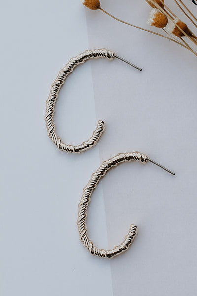 Gold Oval Hoop Earrings flat lay
