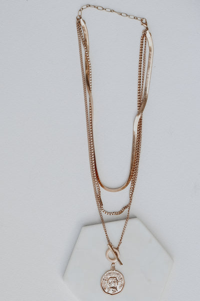 Gold Layered Coin Necklace flat lay