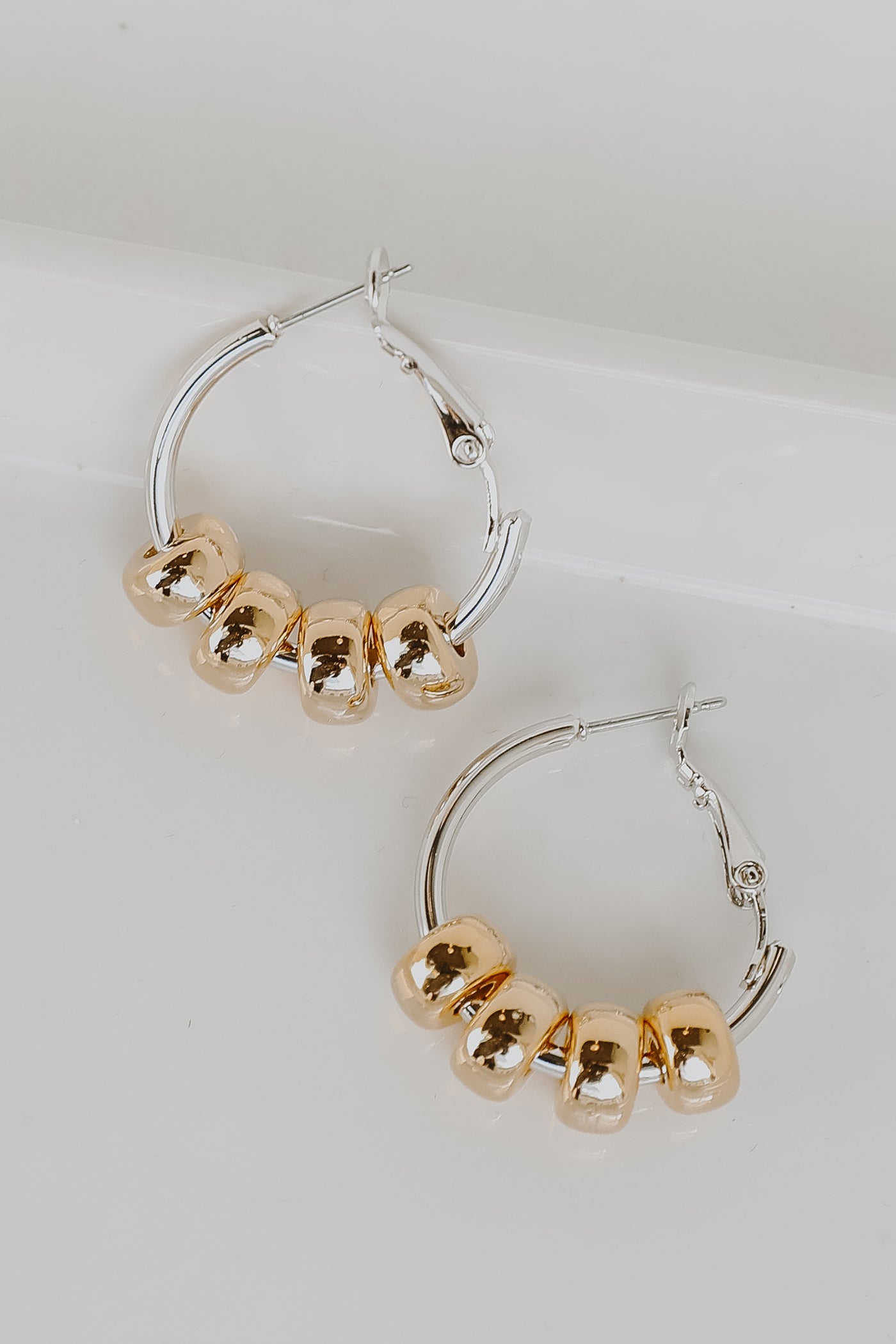 Gold Beaded Hoop Earrings flat lay