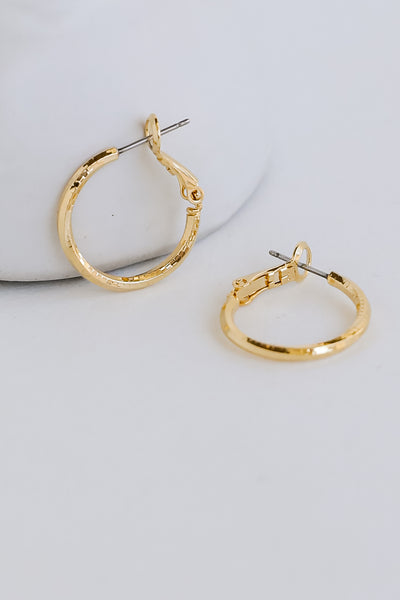 Gold Mini Hoop Earrings flat lay