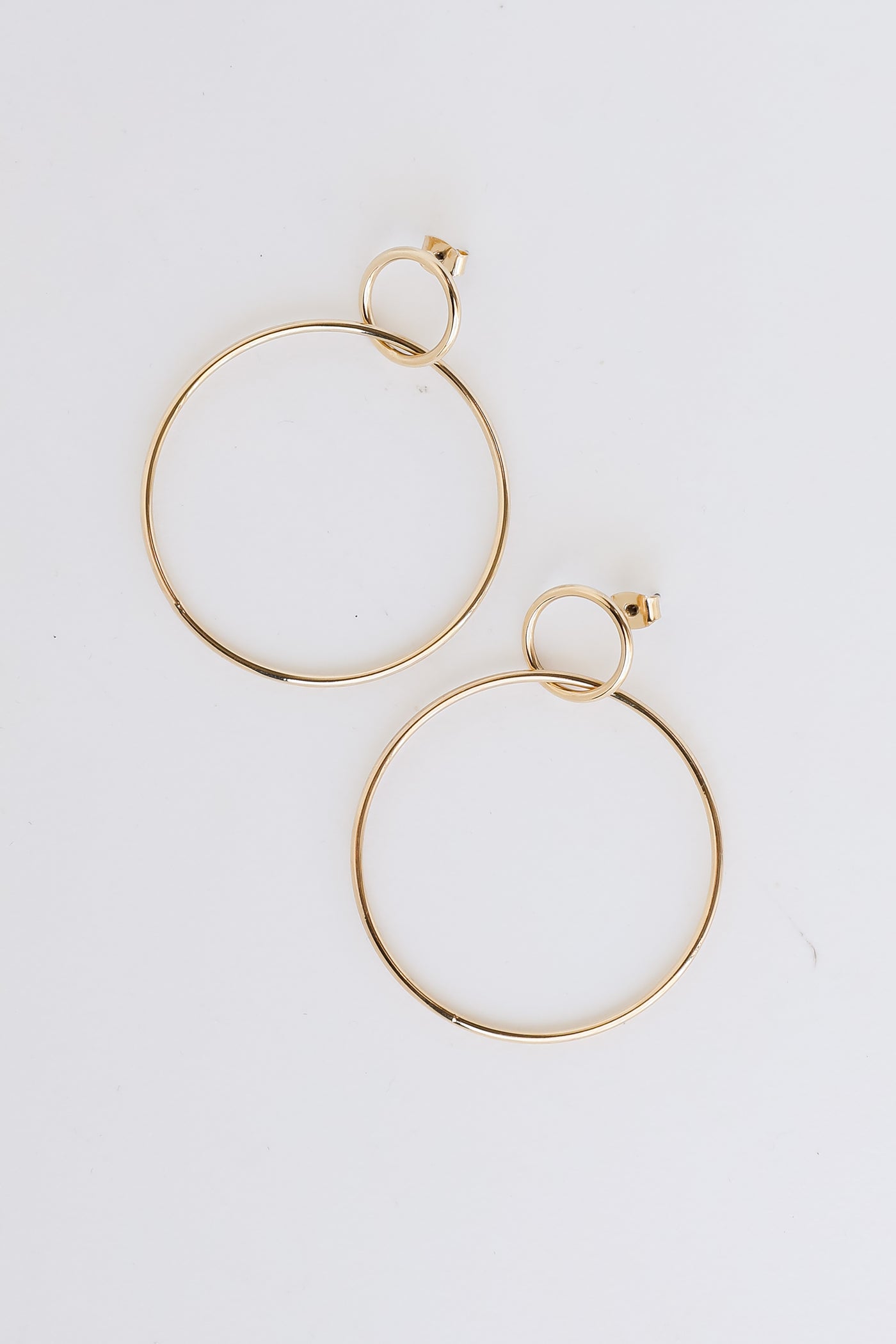 Gold Circle Drop Earrings flat lay