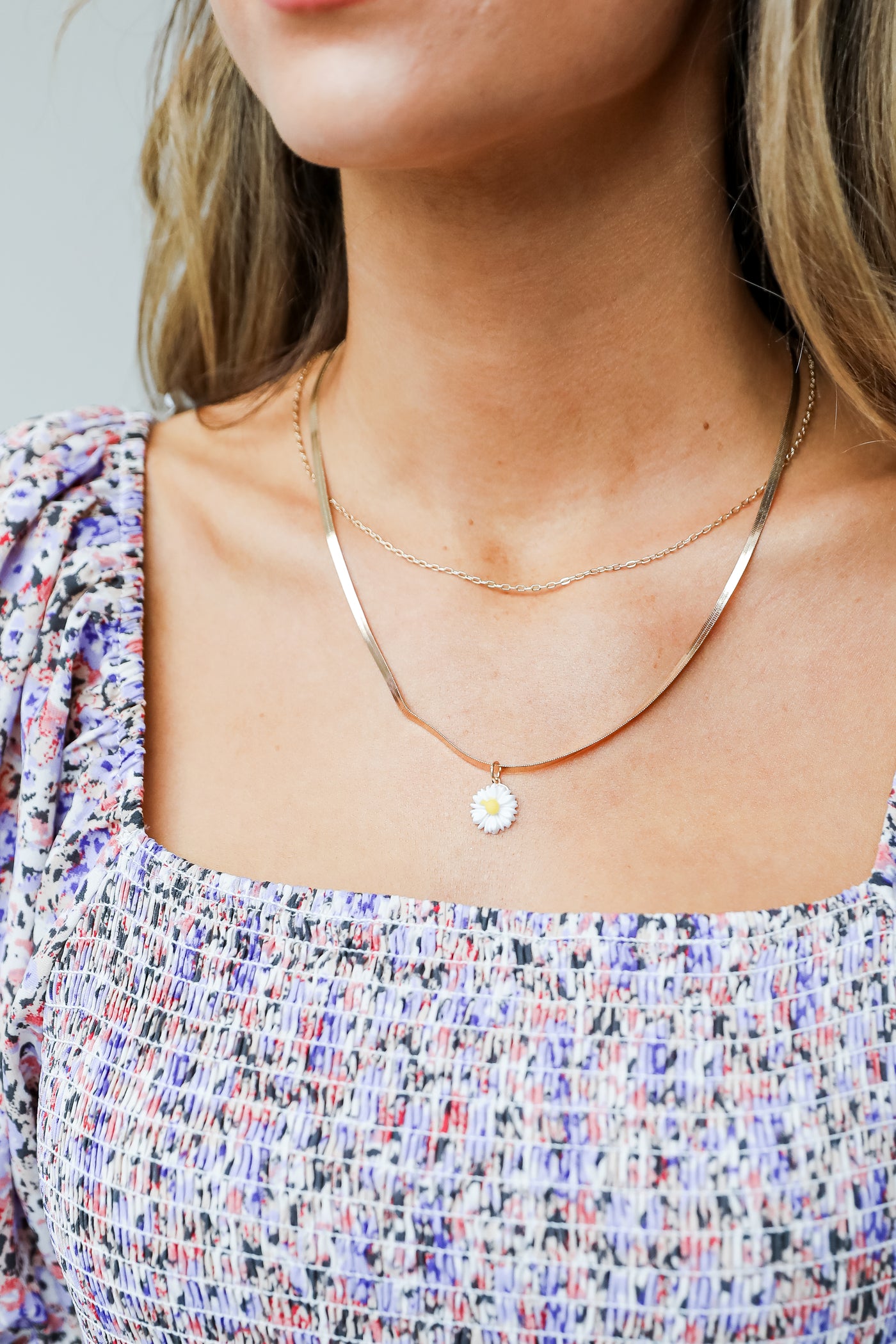 Gold Layered Daisy Charm Necklace on model