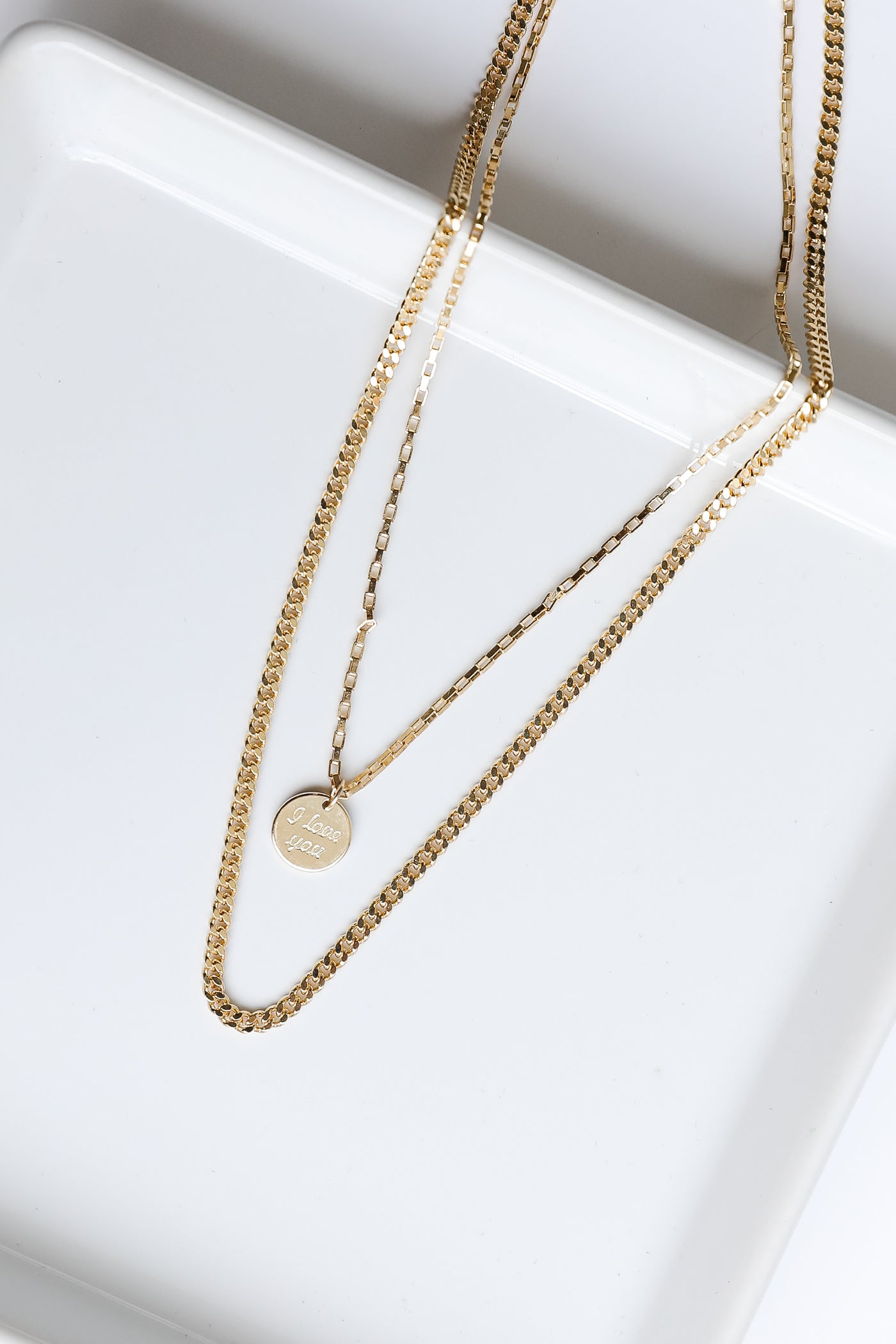 flat lay of a gold necklace