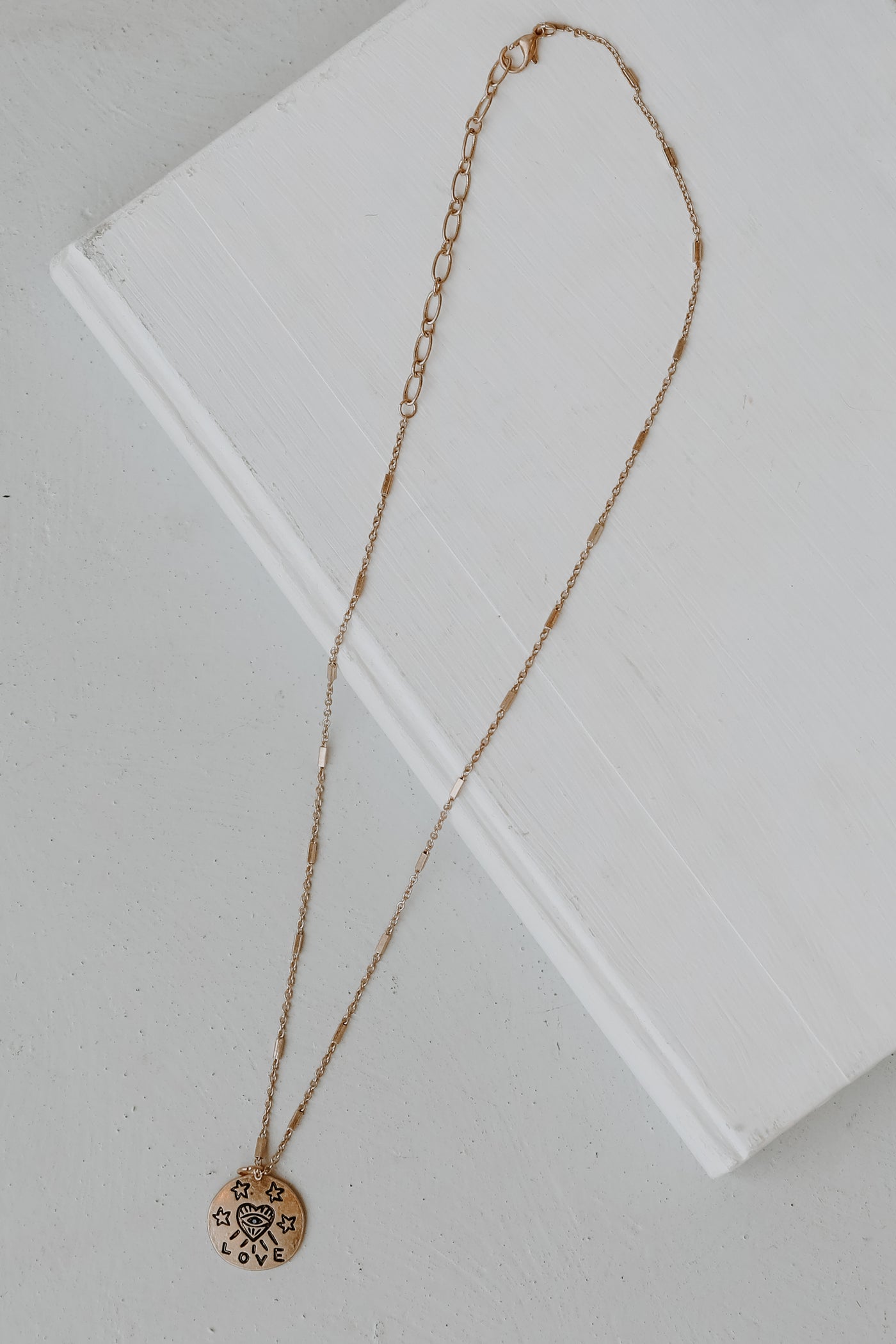 Gold Pendant Necklace flat lay