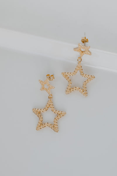 Gold Star Drop Earrings flat lay