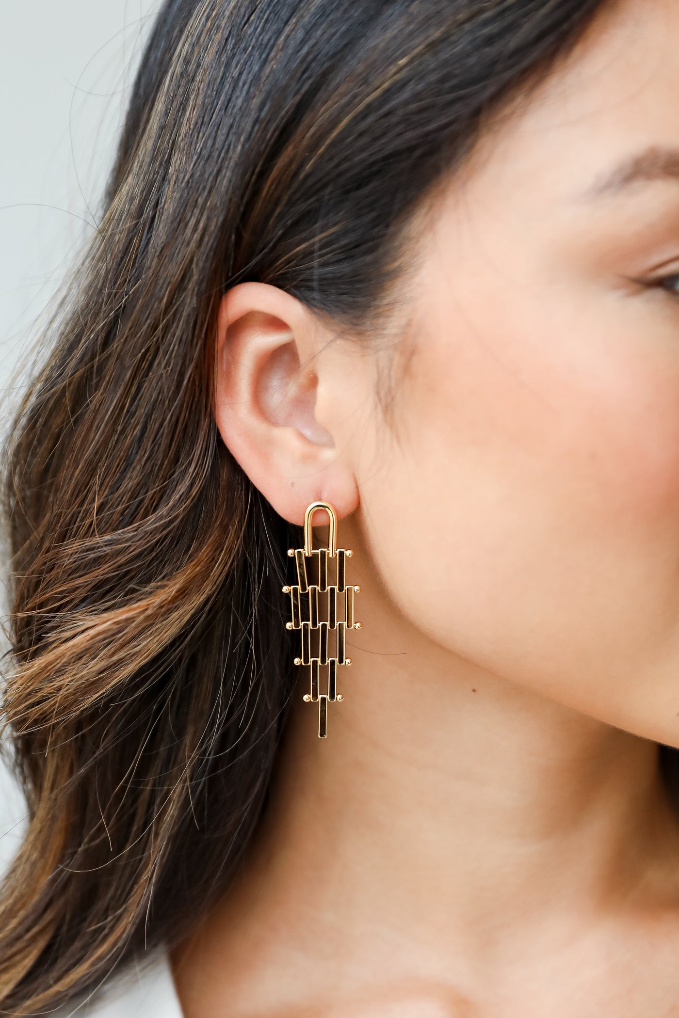 gold tiered earrings