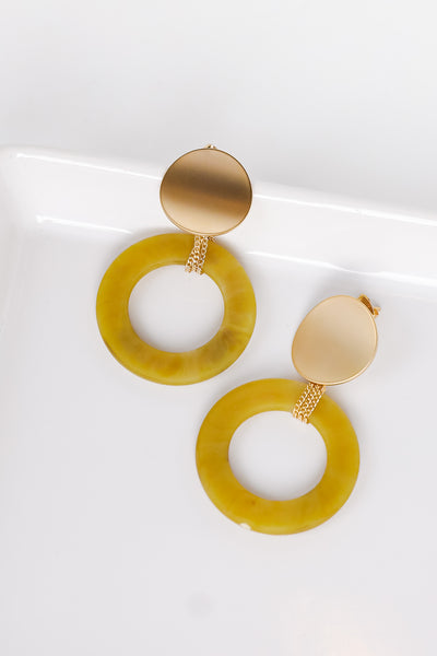 Acrylic Drop Earrings in mustard flat lay