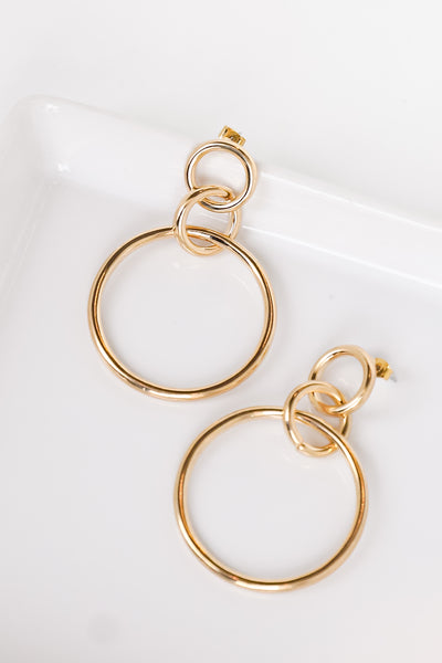 gold circle earrings flat lay