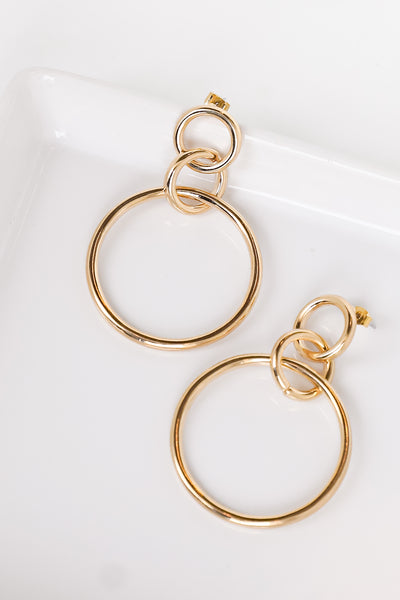 gold circle earrings close up