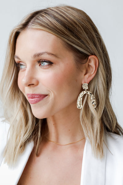 Gold Hammered Statement Earrings on model
