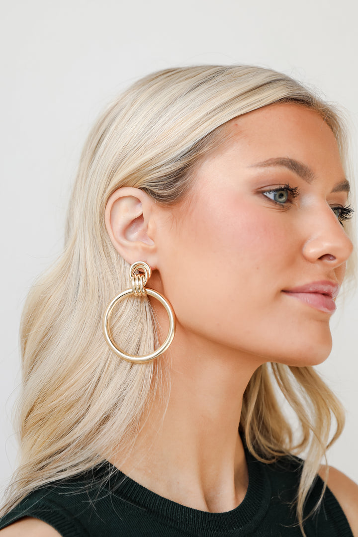 Gold Circle Statement Earrings on model