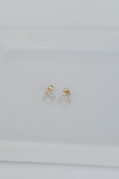 Gold Rhinestone V Stud Earrings flat lay