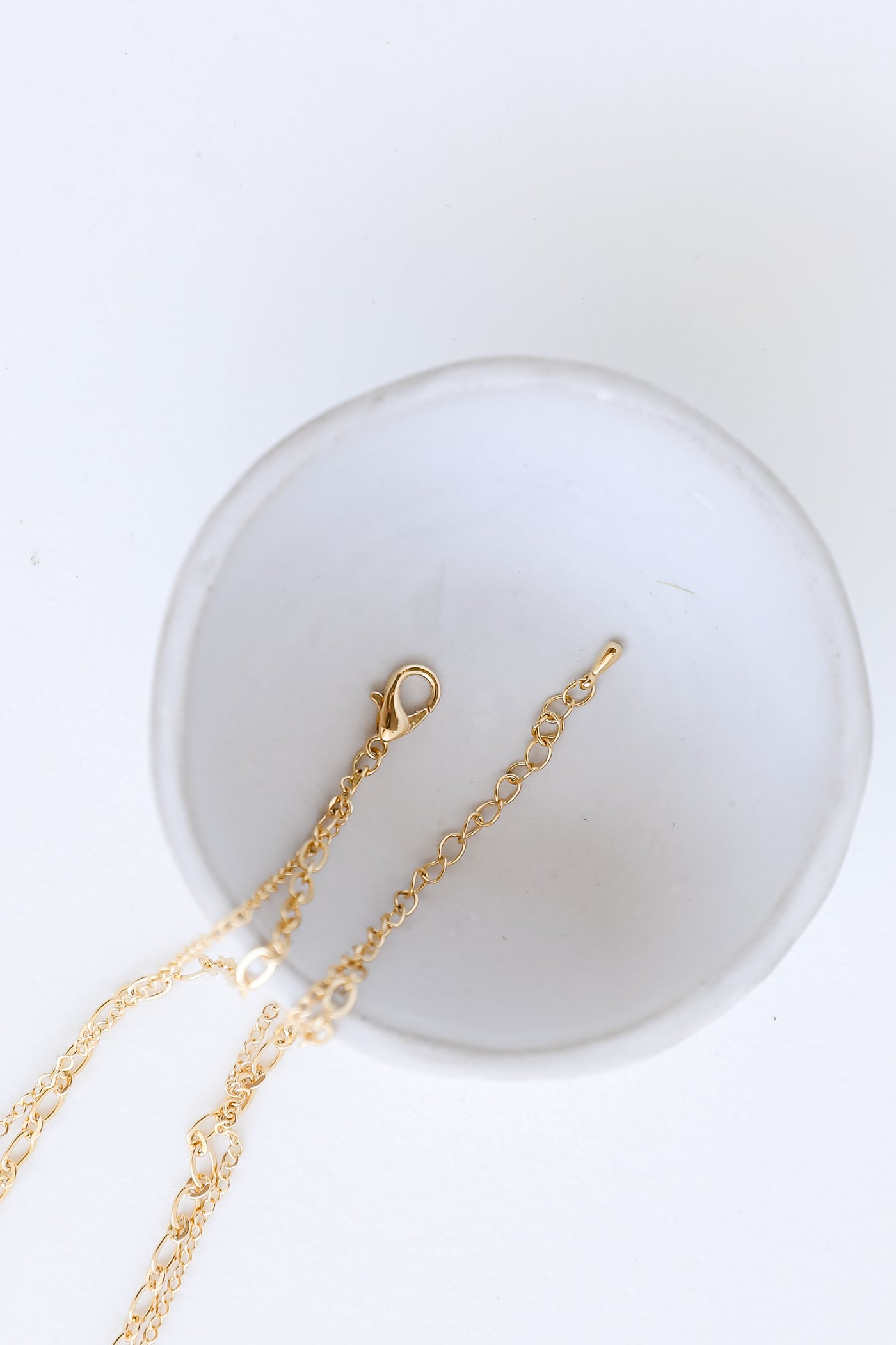 Gold Layered Necklace close up flat lay